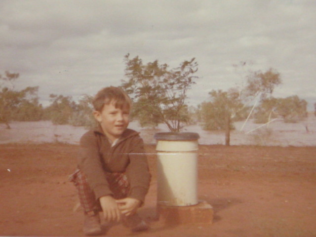 Neville beside Rain Guage during floods - Ooratippra Station late 60's